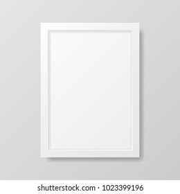 Realistic empty white picture frame, isolated on a neutral gray background. 