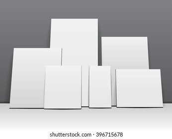 The realistic empty white picture frame or poster on the wall illuminated.Business presentation for branding, gallery design, advertising on wood background. Vector illustration
