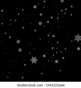 Realistic falling snowflakes isolated on black background.