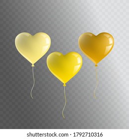 Realistic festive balloons in the shape of a heart light yellow, yellow and dark yellow. Isolated objects.
