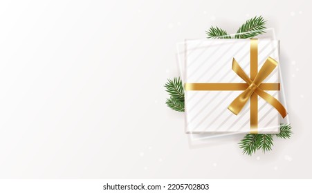 Realistic gift box on a white background with Christmas tree branches. decorative objects. Sale banners, flyers and brochures. Holiday, Christmas, New Year. Top view, flat lay