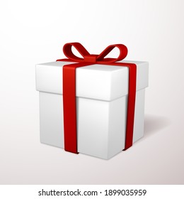 Realistic gift box with red bow isolated on gray background. Vector illustration.