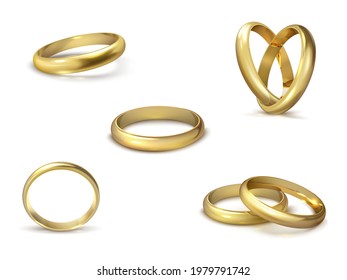 Anillos de boda de oro realistas aislados en el símbolo de fondo blanco del amor y el matrimonio