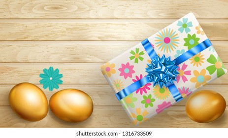 Realistic golden Easter eggs and beautiful gift box with bow on wooden planks
