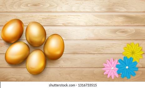 Realistic golden Easter eggs with shadows and several flowers on wooden planks