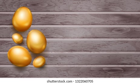 Realistic golden Easter eggs with shadows on wooden planks