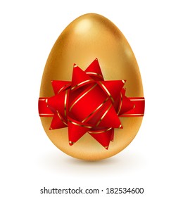 Realistic golden egg tied a red ribbon with big bow