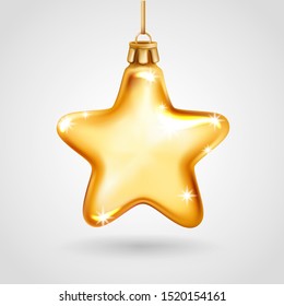 Realistic golden glass Christmas tree toy. Decoration in the shape of a star. Vector illustration. Element for New Years Design