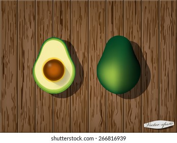 realistic graphic design vector of avocado and half on wood table