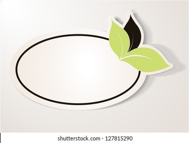 Realistic green eco friendly sticker over beige background. The label contains three leaves, two green and one brown leaf, oval shape. Design element for communication.