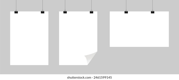 Realistic hanging blank paper sheet with shadow in A4 format and black paper clip, binder on gray background. Design poster, template or mockup. Vector illustration.