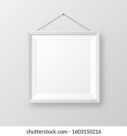 Realistic hanging on a wall blank white picture frame with shadow. Modern poster mockup isolated on gray background. Empty photo frame for art gallery or interior. Vector illustration.