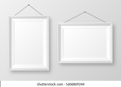 Realistic hanging on a wall blank white picture frame with shadow. Modern poster mockup isolated on gray background. Empty photo frame for art gallery or interior. Vector illustration.