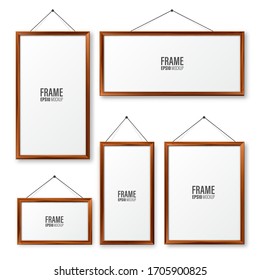 Realistic hanging on a wall blank wooden picture frames set. Modern poster mockup. Empty photo frame with texture of wood. Vector illustration.