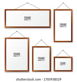 Realistic hanging on a wall blank wooden picture frames set. Modern poster mockup. Empty photo frame with texture of wood. Vector illustration.