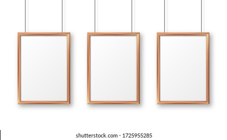Realistic hanging on a wall blank wooden picture frame. Modern poster mockup. Empty photo frame with texture of wood. Vector illustration.