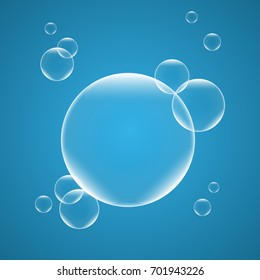 Realistic isolated Soap Bubbles on blue background. Vector Illustration