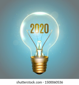 Realistic lamp with the inscription of 2020 year instead of the filament of incandescence, isolated on a blue background