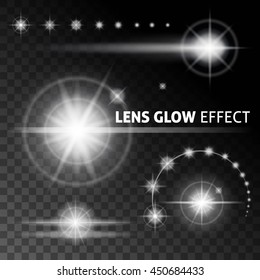 Realistic lens flares and rays flash white light on a dark background. Vector illustrations