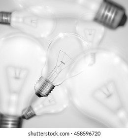 Realistic light bulbs with blurred ones, vector illustration