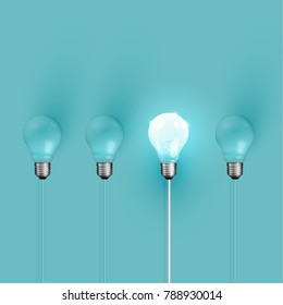 Realistic light bulbs on turquoise background, vector illustration