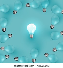 Realistic light bulbs on turquoise background, vector illustration