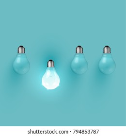 Realistic light bulbs on turquoise background, vector illustration