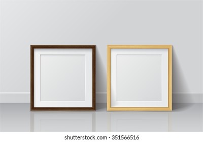 Realistic Light Wood and Dark Wood Blank Picture frame, standing on White Floor at
White Wall from the Front.  Vector illustration
Design Template for Mock Up.