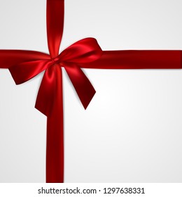 Realistic red bow with crosswise red ribbons isolated on white. Element for decoration gifts, greetings, holidays. Vector illustration.