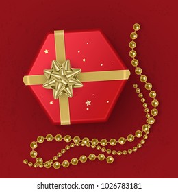 A realistic red gift box decorated with a gold bow, top view. Vector illustration