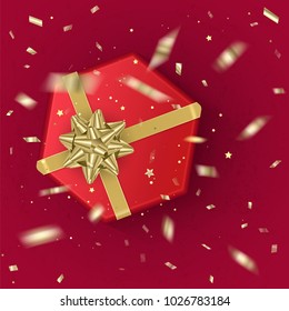 A realistic red gift box decorated with a gold bow, top view. Vector illustration
