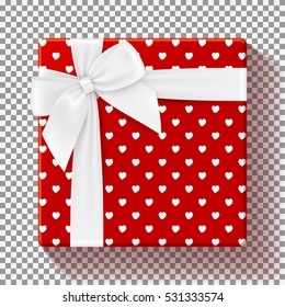 Realistic red gift box isolated on transparent backdrop. Vector illustration. Top view on gift with white bow. Template for greeting card on Christmas, New Year, birthday, and Valentine's Day.