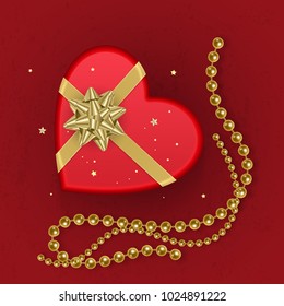 A realistic red gift box with shape of heart decorated with a gold bow, top view. Vector illustration
