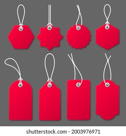 Realistic red price tags with white string on gray background. Special offer or shopping discount label. Retail paper sticker. Promotional sale badge. Vector illustration.