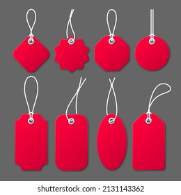 Realistic red price tags with white string on gray background. Special offer or shopping discount label. Retail paper sticker. Promotional sale badge. Vector illustration.