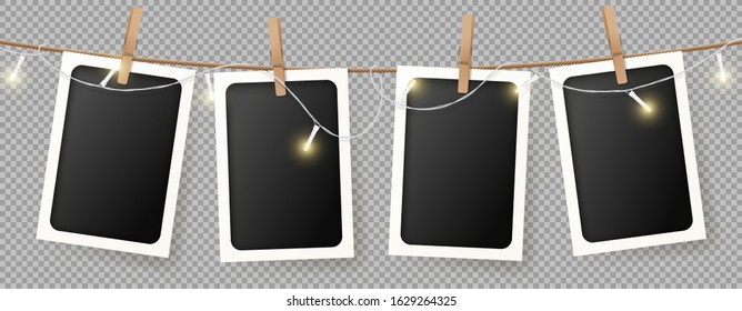 Realistic retro photo frames template. Vector illustration with blank photo cards with sparkling light garland hanging on rope. Mockup concept isolated on transparent background.