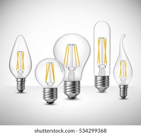 Conjunto realista de bombillas de incandescencia sobre la ilustración vectorial de la superficie gris