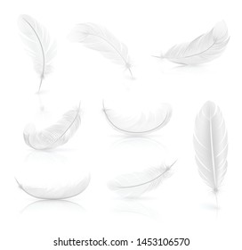 Realistic set of white easy feathers with shadow on smooth white surface vector illustration