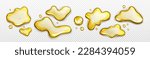 Realistic set of yellow liquid spills and blobs isolated on transparent background. Vector illustration of oil, fruit juice, honey, beer, fuel puddles and drops of abstract shape on surface top view
