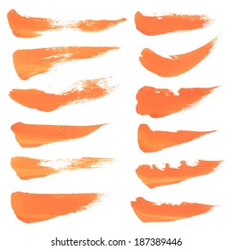 Realistic short strokes thick orange paint on a white surface 2. Vector drawing