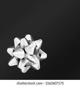 Realistic silver bow isolated on black background. Ribbon. Vector illustration