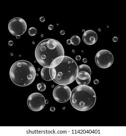 Realistic soap bubbles with rainbow reflection set isolated on the black background. vector Illustration