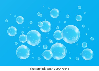 Realistic soap bubbles with rainbow reflection set isolated on the blue background. vector Illustration