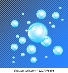 Realistic soap bubbles with rainbow reflection set isolated on the blue transparent background. vector Illustration