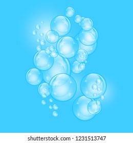 Realistic soap bubbles with rainbow reflection set isolated on the blue background. vector Illustration