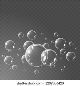 Realistic soap bubbles set isolated on the black transparent background. vector Illustration