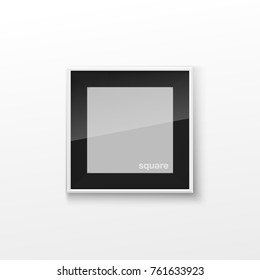 Realistic Square Black and White Blank Picture Frame, hanging on a White Wall from the Front. Vector illustration Empty Frame with Shiny Glass. Design Template for Mock Up.