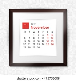 Realistic square picture frame with calendar for November 2017. Isolated on pixel background. Vector illustration.