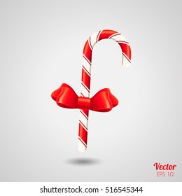 Realistic Striped sweet Candy cane with red bow isolated on background. Vector illustration, isolated object, Christmas candy cane. Merry Christmas, new year, festive candy.