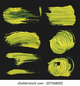 Realistic strokes drawn thick yellow paint on black background